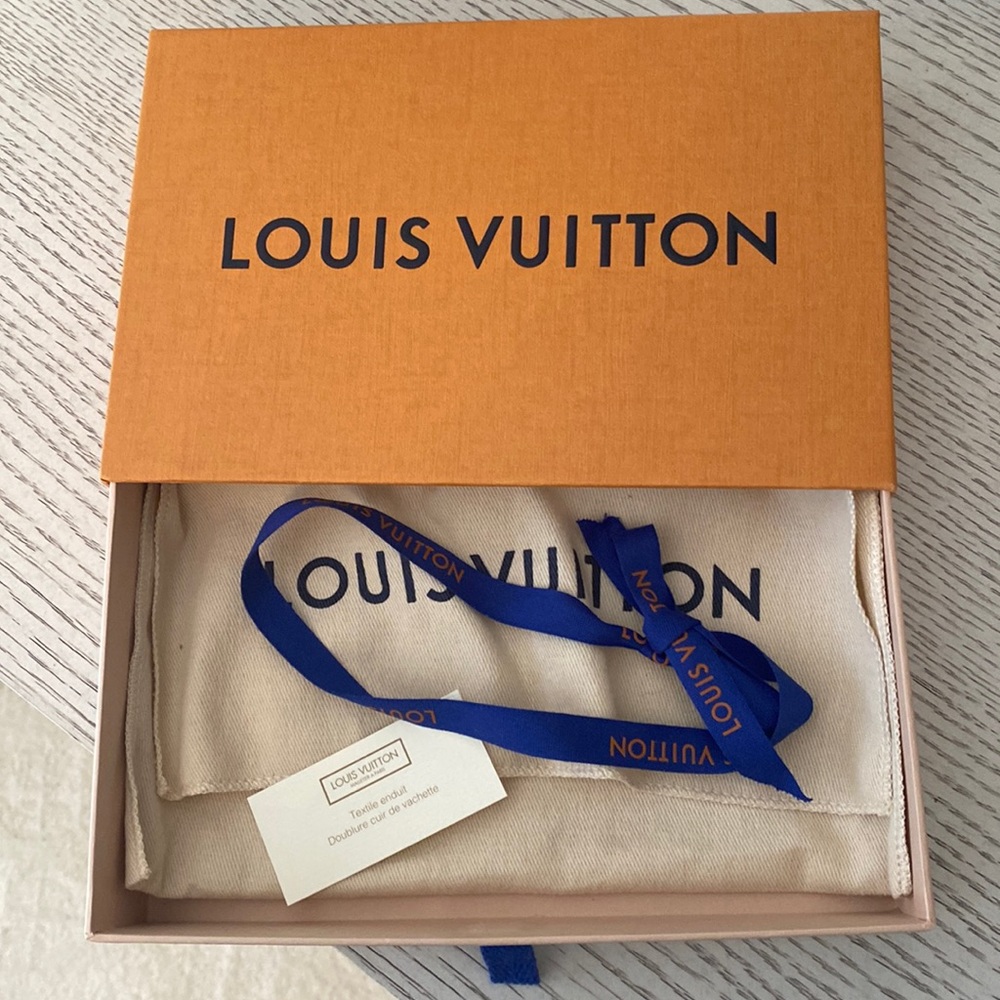 Authentic Louis Vuitton box, pouch and ribbon. Brand new in perfect condition!